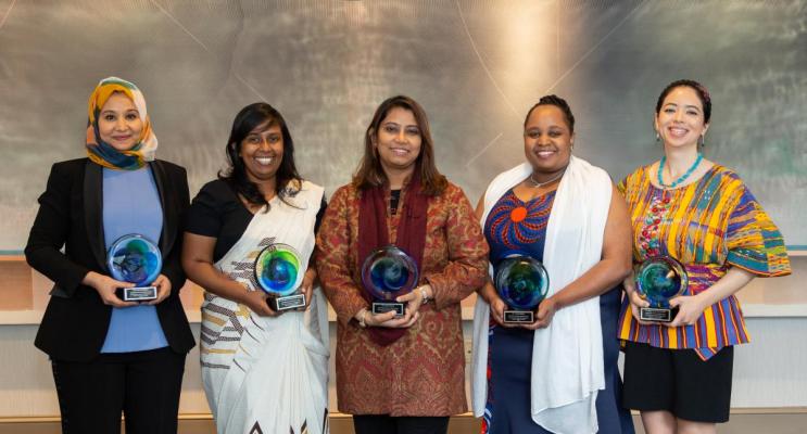 Women holding awards