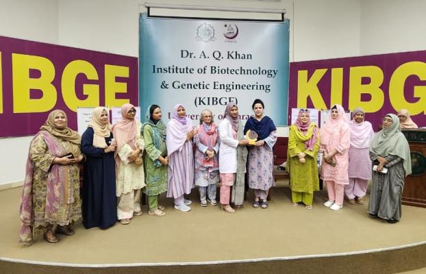 shield presentation to Dr Wafa Altaf