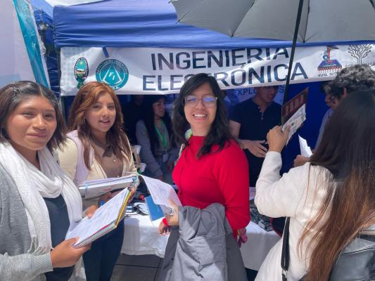 Young women attend a science fair in La Paz