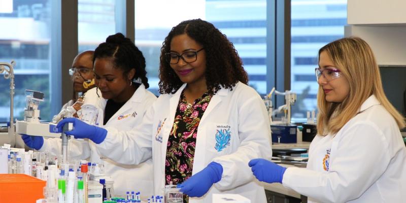 Women scientists conduct experiments in a laboratory