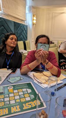 Two women playing a card game