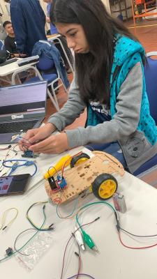 girl taking part in electronics experiment Bolivia