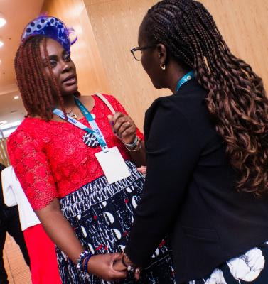 Two women holding hands