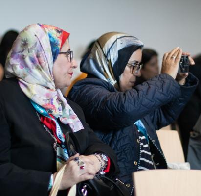 Audience members capturing the moment