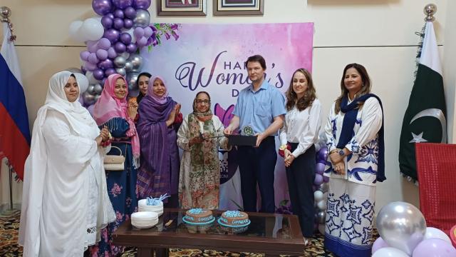 Women's day group photo with hosts