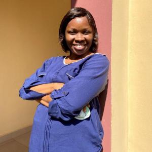 A professional portrait of Adedeji Deborah Oluwayemisi, a Ph.D. candidate at Obafemi Awolowo University and lecturer in Clothing and Textile Design at the University of Ilesa, Nigeria, representing her work in sustainable fashion and textile innovation.