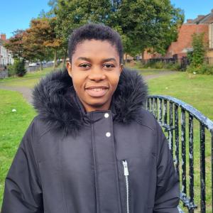 Headshot of Idongesit Thomas on a winter jacket