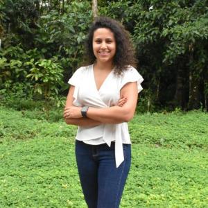 A picture of me in front of a green forest in the jungle