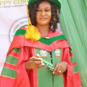 Portrait of Jane Nwaekpe at her PhD convocation ceremony in academic gown and cap.