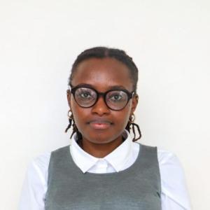 Portrait of Marylyn Mugure Gathiru, an analytical chemist and researcher, smiling and wearing professional attire.