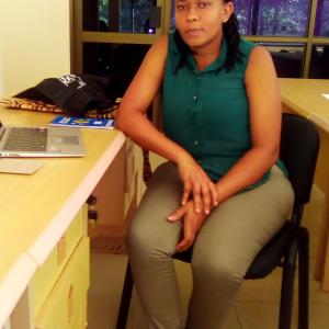 Dr Solange Portrait of Solange Uwingabire in an office