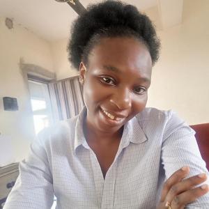 Mrs Adeyanju sitting in an office 