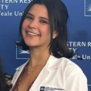 Image of Paulina during her PhD whote coat ceremony