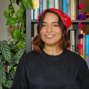 This is a photo of me with my books and my plants. 
