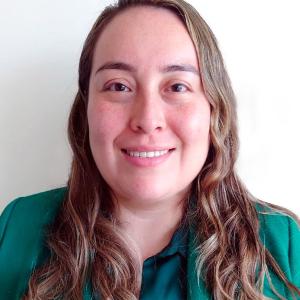 Professional headshot of Lizeth Vega Medina in a formal academic setting.