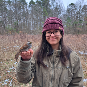 M. Elisa González with a White-throated Sparrow in her hand