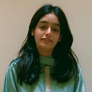 Professional headshot of a female MPhil Chemistry student, facing the camera with a neutral background.