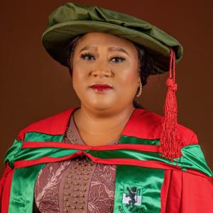Dr. Florence Obiageli Nduka in her convocation regalia, celebrating the successful completion of her academic achievements with pride and distinction.