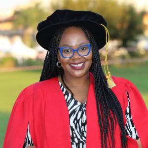 A picture of Nthabeleng Molupe in a PhD regalia