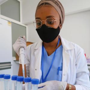 Researcher analyzing samples in a laboratory