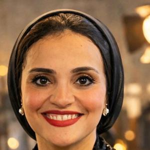 Professional headshot of Professor Rehab Hegazy in formal attire.