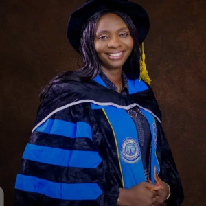 Picture with my Ph.D convocation gown