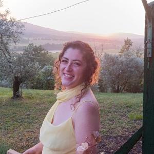 Estefania smiling in front of the sunset