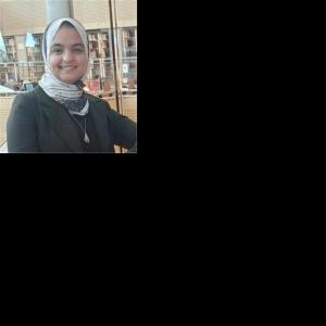 Professional portrait of Aya Mostafa Matloob, a researcher in chemistry and sustainable energy, wearing formal attire."