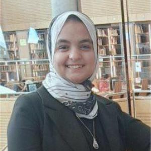 Professional portrait of Aya Mostafa Matloob, a researcher in chemistry and sustainable energy, wearing formal attire."