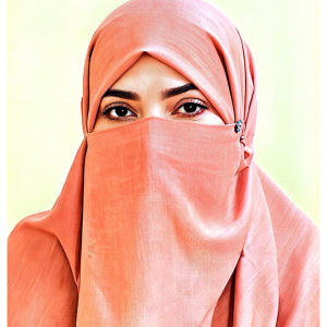 in peach niqab, only eyes visible